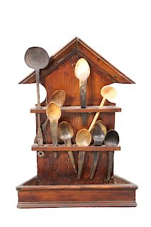AN 18TH CENTURY PINE SPOON RACK, with pointed pediment, wit