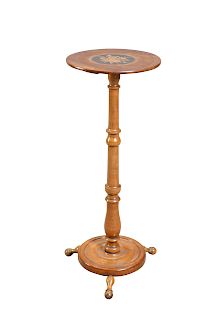 A 19TH CENTURY WALNUT CANDLE STAND, the circular top centre