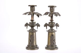 A PAIR OF 19th CENTURY PATINATED METAL CANDLESTICKS IN THE 