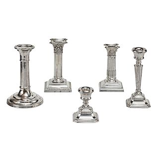 Five silver candlesticks, England