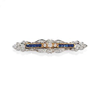 A 18K two color gold, diamond and sapphire brooch