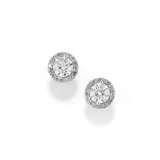 A 18K white gold and diamond earclips, with IGI Certificate