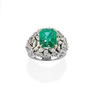 A 18K white gold, diamond and emerald ring
