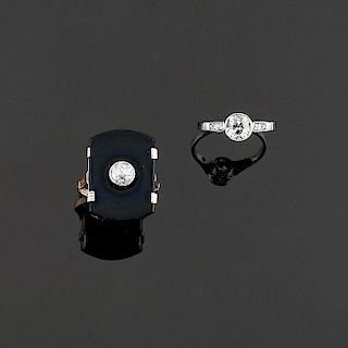 A 18K two-color gold, onyx and diamond rings