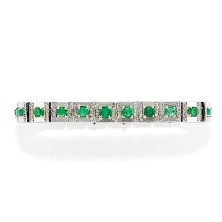 A 18K white gold, diamond and emerald bracelet