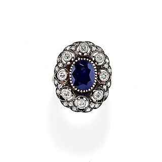 A 18K gold, silver, sapphire and diamond ring