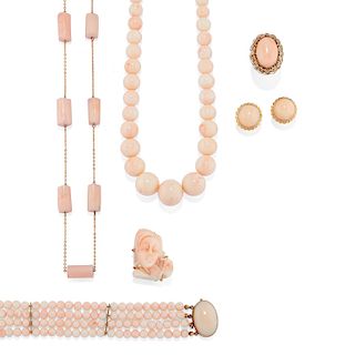 A 18K yellow gold and pink coral: two necklaces, one ring, one brooch, one earring, and one bracelet