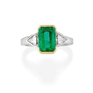 A 18K two color gold, emerald and diamond ring