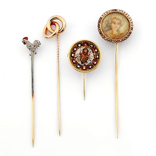 Four 18K yellow gold tie pins