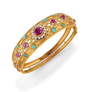 A 18K yellow gold, ruby, diamond and turquoise bangle