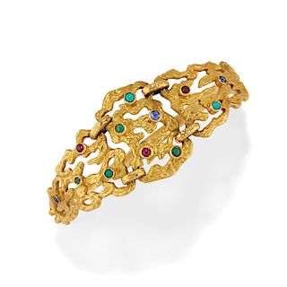 A 18K yellow gold, ruby, sapphire, emerald and turquoise bangle