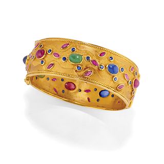 A 18K yellow gold, ruby, sapphire and jade bangle