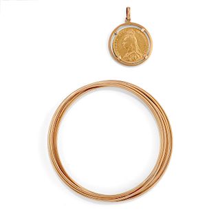 A 18K yellow gold and british pound with bangle