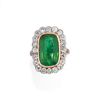 A low-carat gold, green gemstone and diamond ring