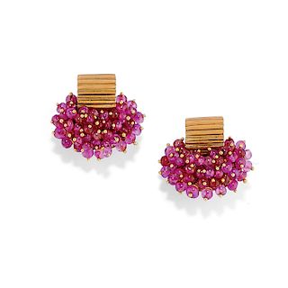 A 18K yellow gold and ruby earring
