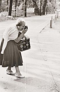 Robert Frank (Swiss, b. 1924)      Woman Taking Pictures with a Point-and-Shoot Camera