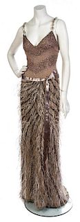 * An Eric Gaskins Beige Crepe Evening Gown, Size 6.