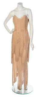 * A Fabrice Beige Silk Beaded Strapless Gown, Size 10.
