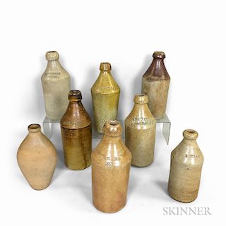 Seven Stoneware Bottles and a Flask