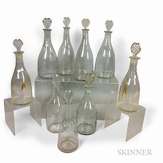 Nine Colorless Blown Glass Decanters with Heart-form Stoppers