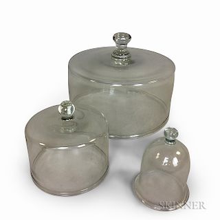 Three Colorless Blown Glass Covers