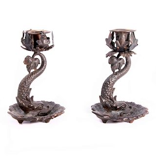 A pair of Dolphin candlesticks.