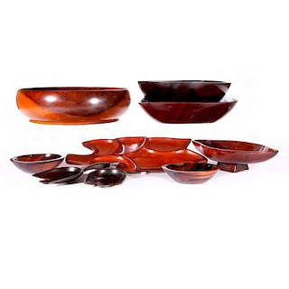 Three groups of carved wooden bowls.