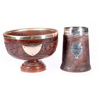 A commemorative mug and a carved bowl.