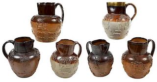 Six Sprig Decorated Stoneware Tavern Pitchers