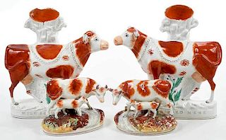 Four Staffordshire Cow Figures