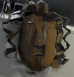 Large Cut Metal Sculpture of a Face.