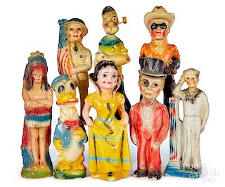 Eight carnival chalkware figures