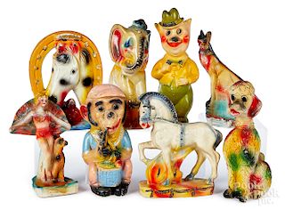 Eight carnival chalkware figures