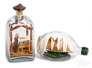 Two carved dioramas in bottles