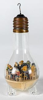 Carved and painted diorama in a lightbulb