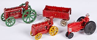 Three Arcade farm tractors with integral drivers