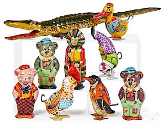 Eight Chein tin lithograph wind-up toys