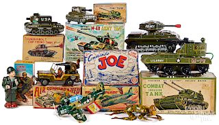 Eight military battery operated and wind-up toys