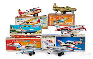 Four Japanese tin friction airplanes, etc.
