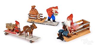 Three composition Santa Claus with sleigh figures