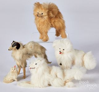 Four doll size hide and fur covered dogs, etc.