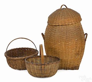 Three splint baskets, to include a feather basket