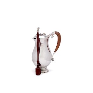 Georg Jensen sterling silver chocolate pot with a mahogany handle and a silver mounted rosewood stirrer, design #460B by Georg Jensen from 1925.Meas