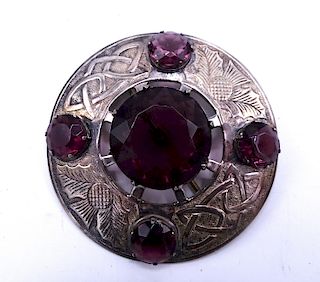 CELTIC STYLE BROOCH WITH PURPLE STONES