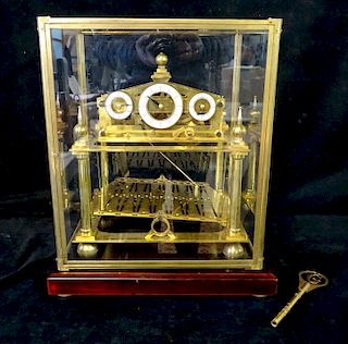 CONGREVE BRASS ROLLING BALL CLOCK IN GLASS WITH KEY