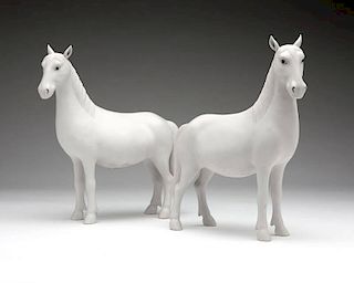 A pair of Chinese bisque porcelain horses