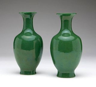 A pair of Chinese apple green glazed vases
