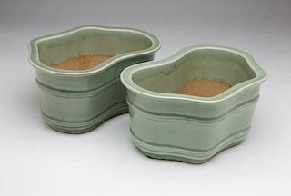 A pair of Chinese celadon jardinieres