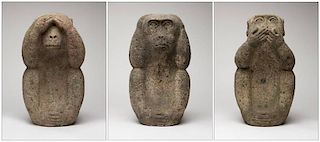 A group of three Japanese carved stone wise monkeys