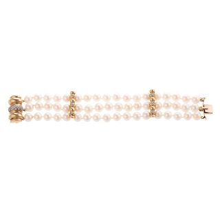 A Three Strand Pearl Bracelet with Diamonds in 14K